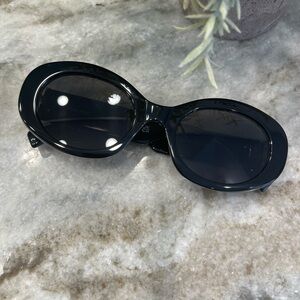 Miu Miu black oval sunglasses